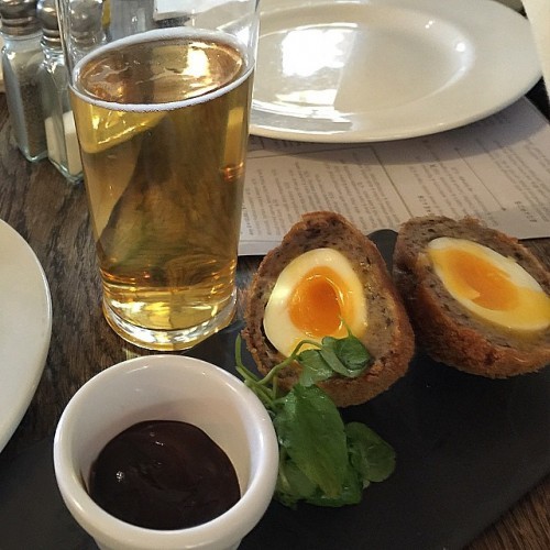 First time eating scotch eggs at a London pub with a larger #thewhitelionpub #scotcheggs #hpsauce #hp #beer #eggs #scotch #food #lovefood #England #London #pub