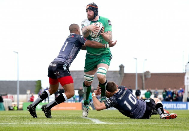 Eli Walker and Dan Biggar tackle Aly Muldowney