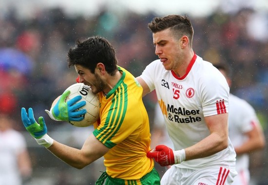 Ryan McHugh is tackled by Conor McAliskey