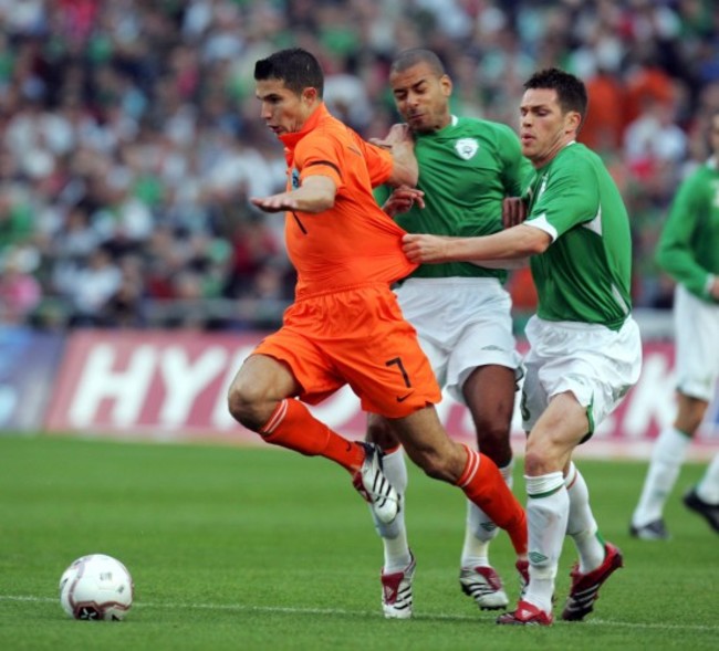 Robin Van Persie gets tackled 16/8/2006