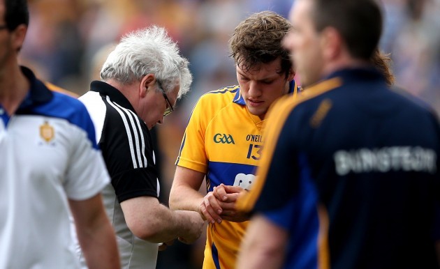 Shane OÕDonnell gets treatment for a hand injury