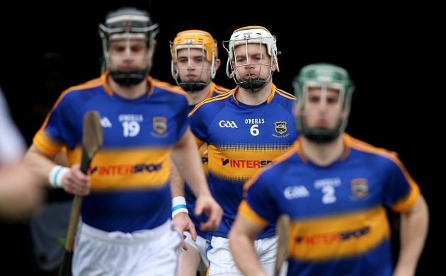 Padraic Maher and the Tipperary team their way out for the game
