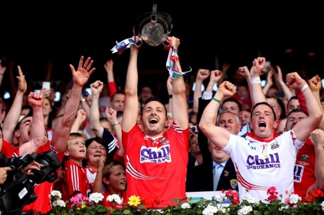 Patrick Cronin lifts the trophy