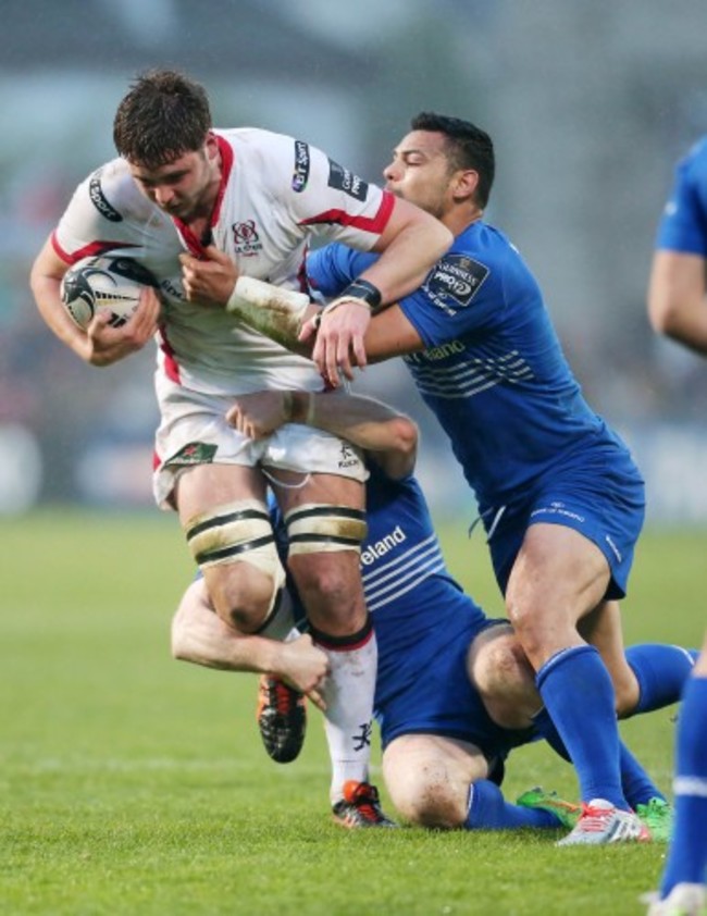 Iain Henderson is tackled by Ben Te'o and Gordon D'Arcy