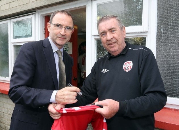 Martin O'Neill signs a jersey for Philip Johnston