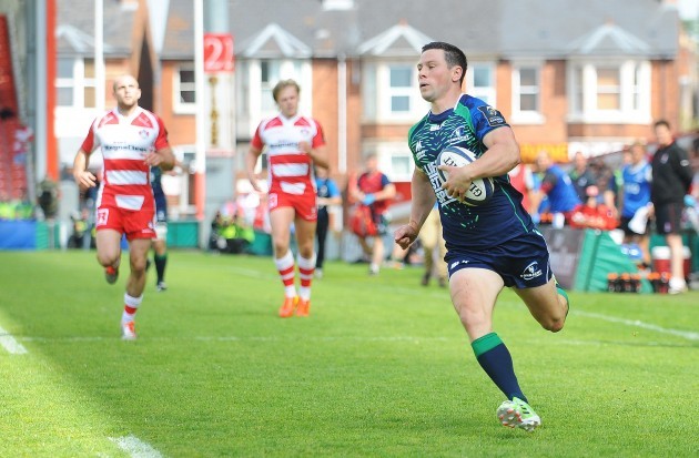 John Cooney runs in his side's first try