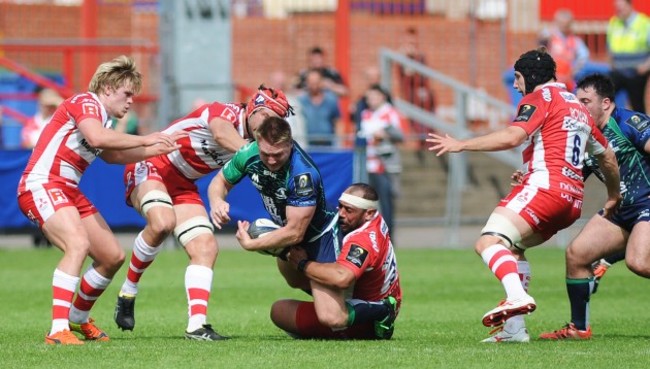 Tom McCartney is tackled by John Afoa