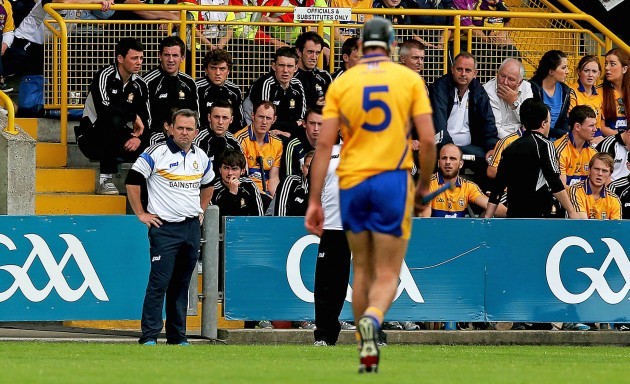 Davy Fitzgerald looks on as Brendan Bugler leaves the field after being sent off