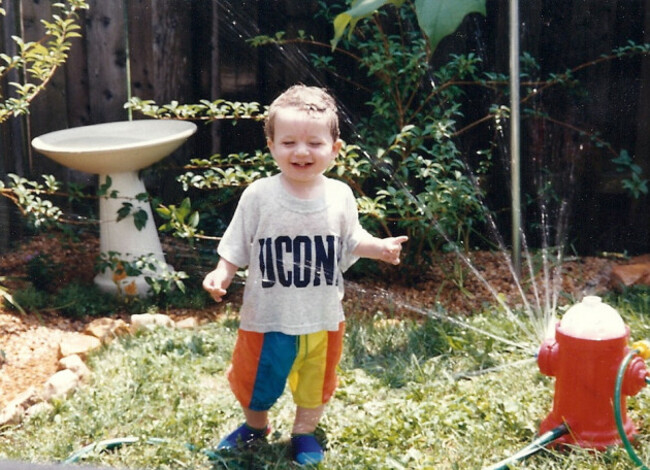 toddler with sprinkler