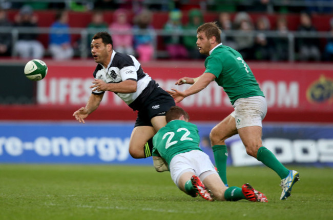 Paddy Jackson and Chris Henry tackle George Smith