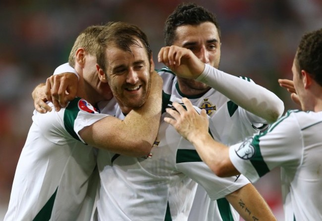 Niall McGinn celebrates scoring with teammates
