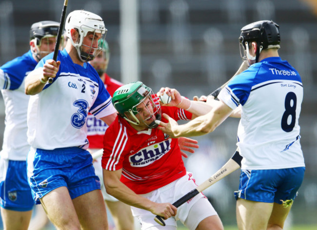 Shane Fives and Jamie Barron tackle Alan Cadogan