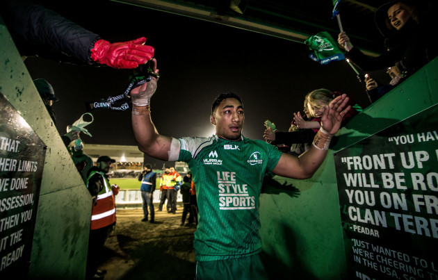 Bundee Aki celebrates with fans after the game