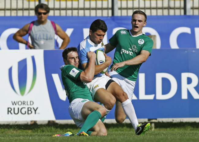 Lautaro Velez tackled by Billy Dardis and Nick McCarthy