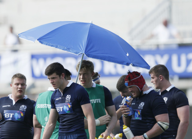 Scotland players take water onboard during a stoppage in play for a water break