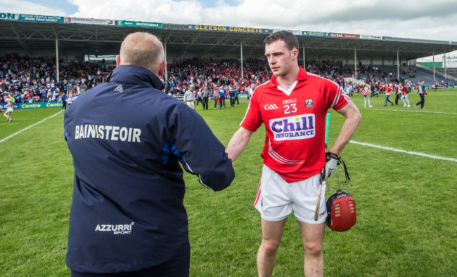 Derek McGrath shakes hands with Darren McCarthy