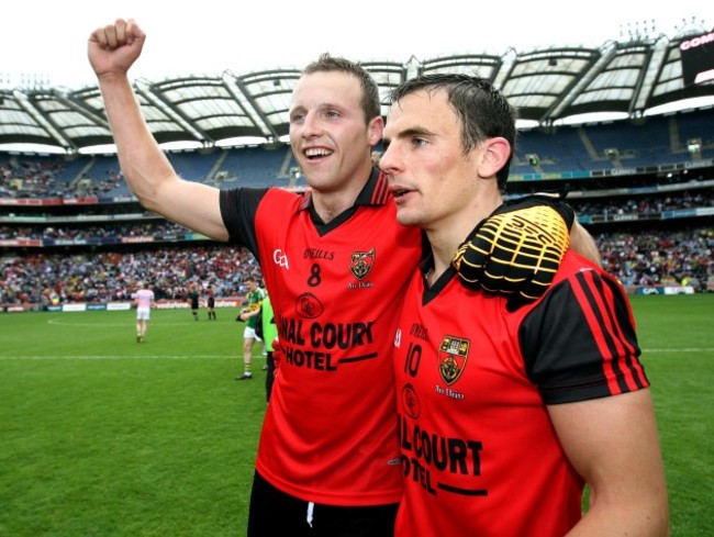 Ambrose Rogers and Daniel Hughes of Down celebrate after the final whistle