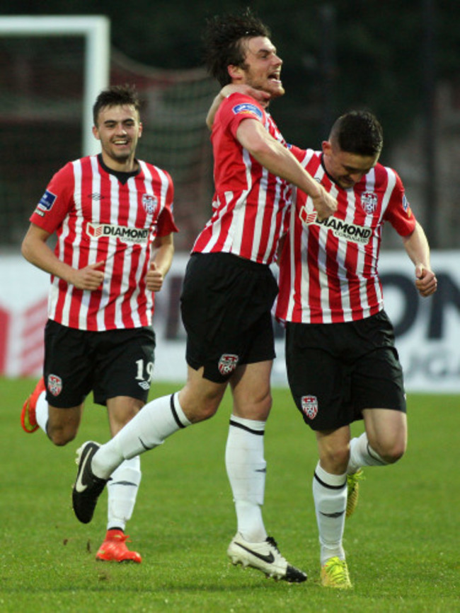 Philip Lowry celebrates scoring with Mark Timlin and Dean Jarvis