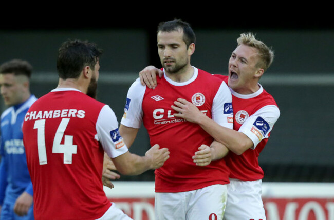 James Chambers and Conor McCormack congratulates goalscorer Christy Fagan