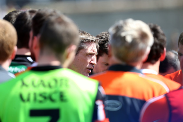 Kieran McGeeney talk to his players at the end of the game