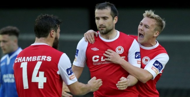 James Chambers and Conor McCormack congratulates goalscorer Christy Fagan