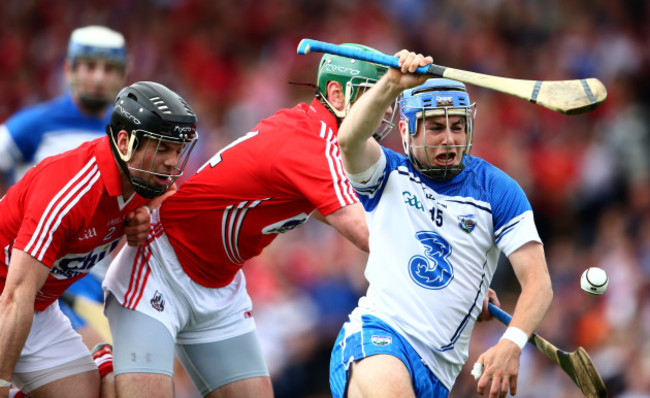 Shane O&Otilde;Neill and Stephen McDonnell tackle Colin Dunford