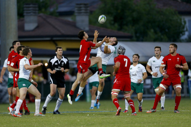 Ciaran Gaffney competes for a high ball with Tomos Williams  15/6/2015