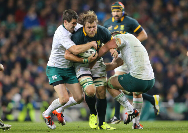 Jonathan Sexton and Rhys Ruddock tackle Duane Vermeulen