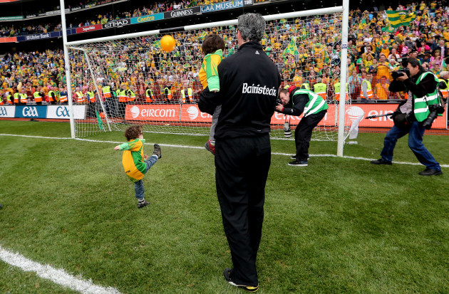 Jim McGuinness watches his son Mark Anthony kick a point after the game 23/9/2012
