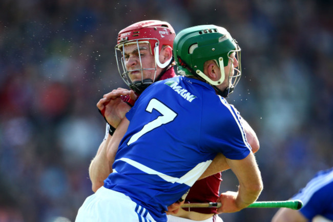 Jonathan Glynn with a hard shoulder on Tom Delaney