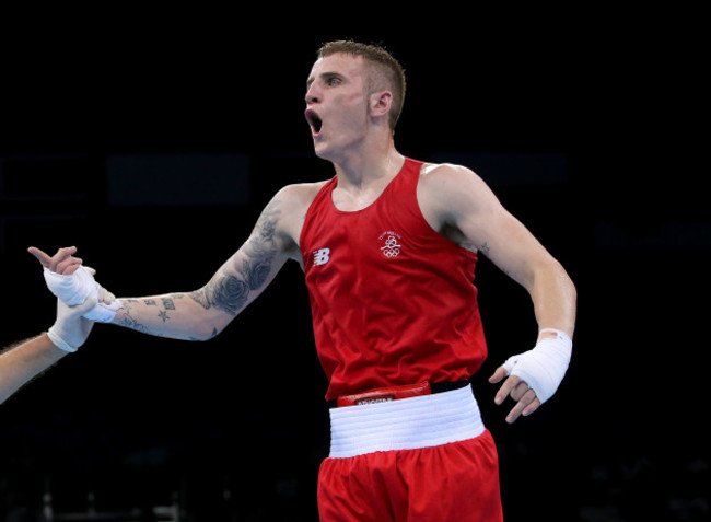 Dean Walsh celebrates after beating Maxim Dadahev on a split decision