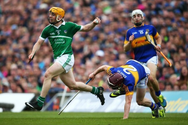 Seanie OÕBrien is tackled by Paddy Stapleton