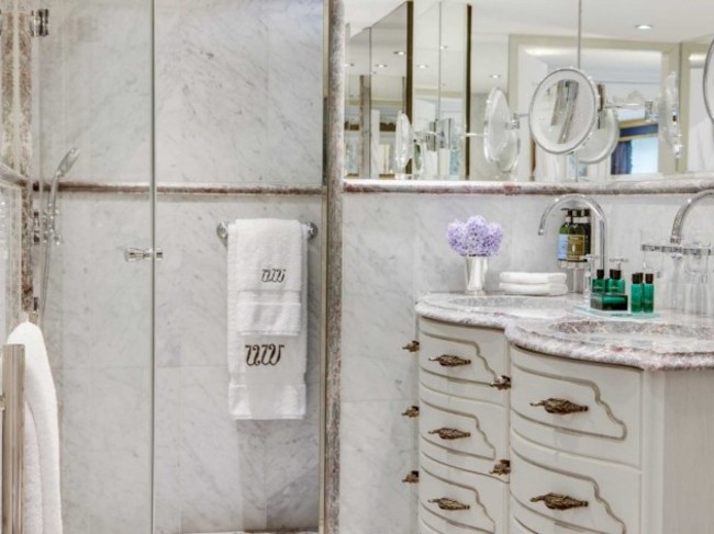 the-suite-bathroom-features-a-shower-sink-and-more-than-enough-mirrors