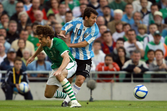 Kevin Kilbane with Lionel Messi
