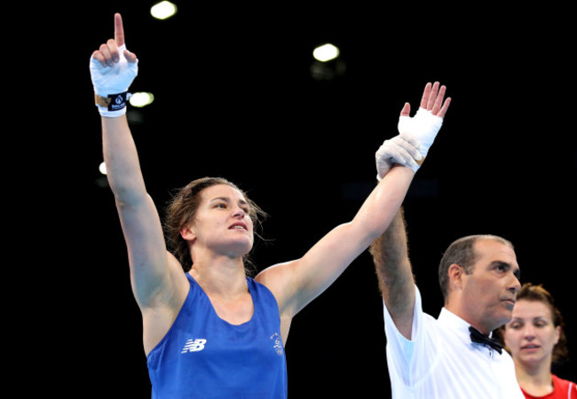 Katie Taylor celebrates as she is declared the winner against Yana Alekseevna