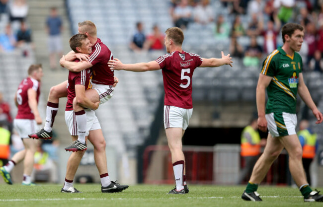 John Heslin, Dennis Glennon and Paddy Holloway celebrate at the final whistle