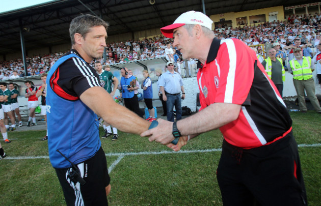 Kieran McGeeney and Mickey Harte shake hands after the game
