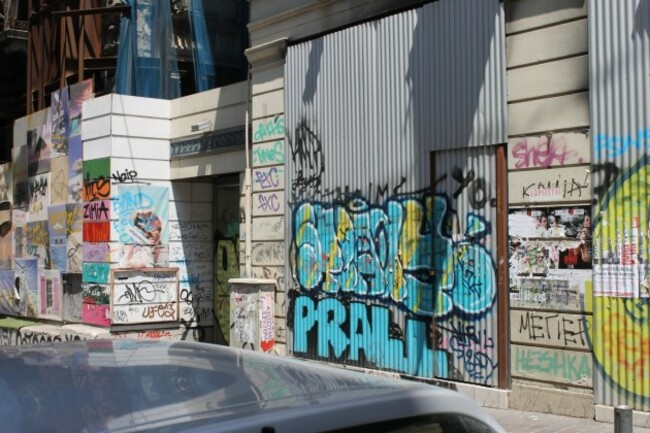 even-farther-up-the-street-toward-the-prime-shopping-area-there-were-buildings-that-looked-as-if-they-had-been-left-alone-for-a-long-time