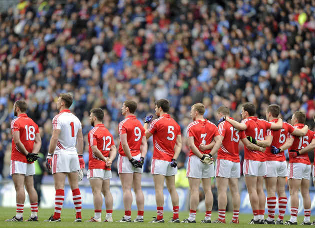 Cork players stand for the national anthem