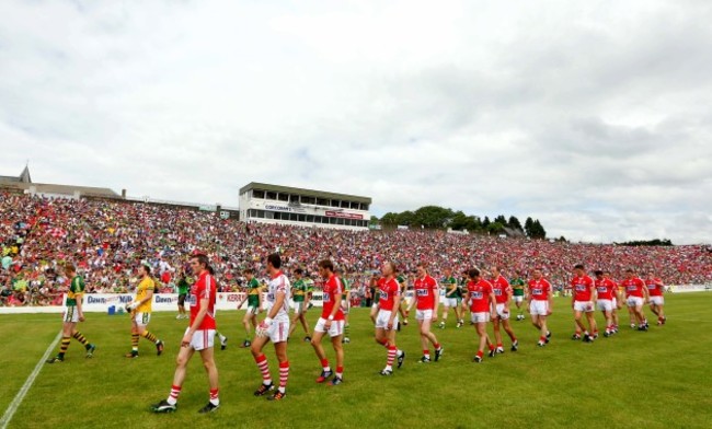 The teams are lead out onto the pitch before the game