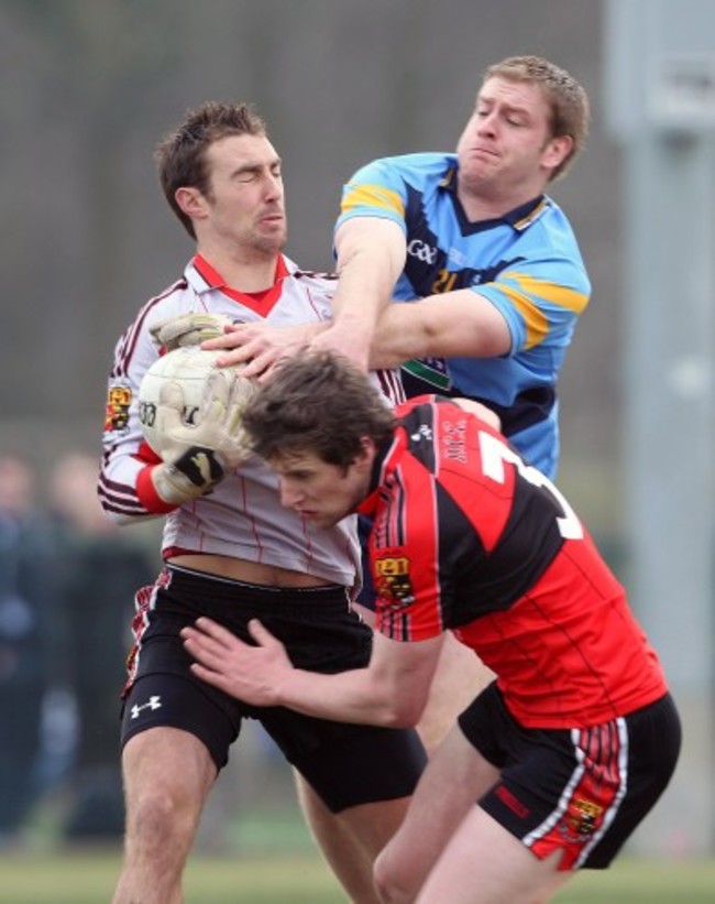 Donal Kingston tackles Ken O'Halloran and Eoin O'Mahony