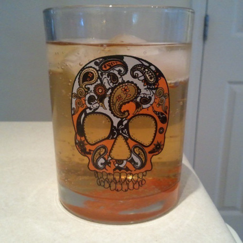 Captain Morgan and Ginger Ale sugar skull style. Went with orange today.