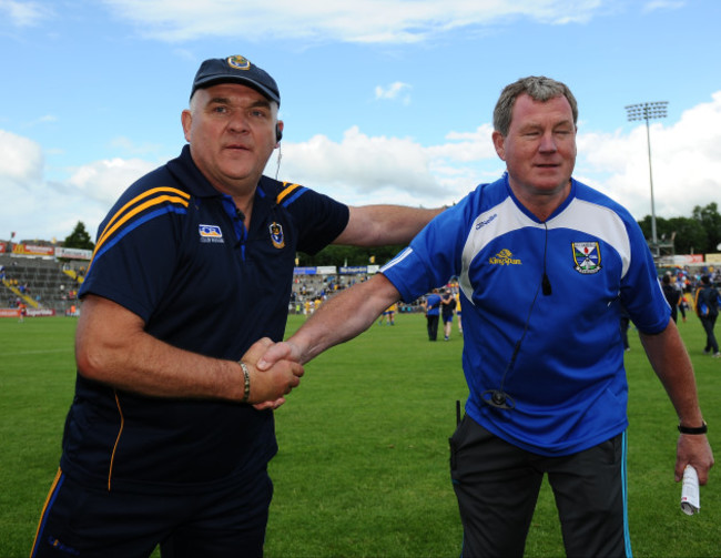 John Evans and Terry Hyland shake hands after the game