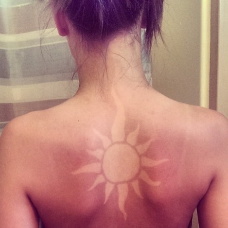 My tan line is pretty rad. #sun #tanning #sunburntattoo #tanline #tanart #prettycool #lopsided #ohwell
