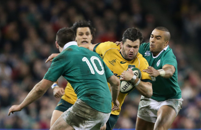 Adam Ashley-Cooper is tackled by Jonathan Sexton and Simon Zebo