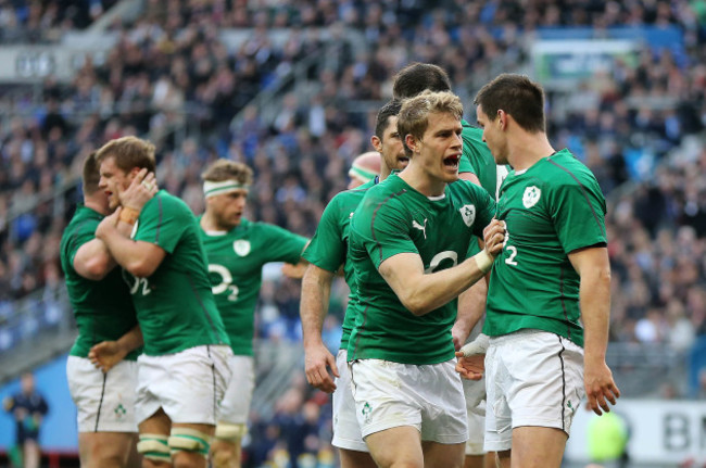 Jonathan Sexton celebrates scoring the opening try with Andrew Trimble