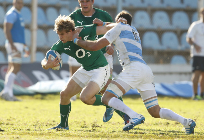 Andrew Trimble is tackled by Antonio Ahualli de Chazal