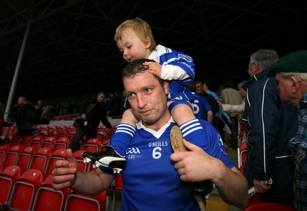Liam Cahill carries his son Billy Cahill