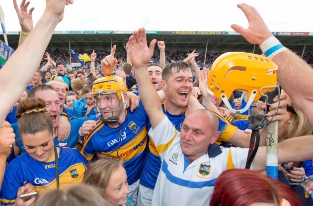 Lar Corbett and Seamus Callanan celebrate with fans after the game