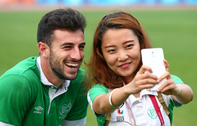 Conor O'Keefe has his picture taken with a volunteer